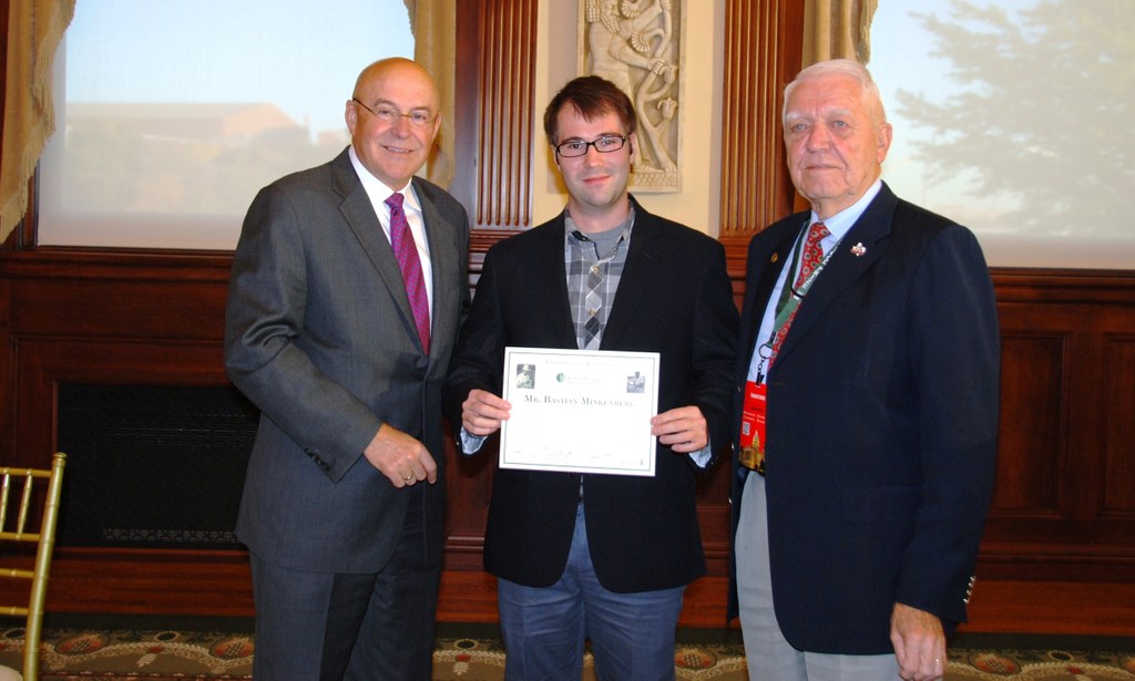 Bastian Minkenberg (middle) receives MBBISP Award certificate from Dr. Robert T. Fraley (left, Monsanto) and Dr. Edward C. A. Runge (right, MBBISP Chair). 