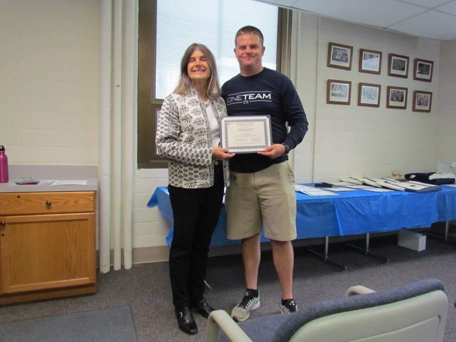 Dr. Carolee Bull (L) presenting Brian Aynardi (R) with the Arthur Gaspari Memorial Scholarship certificate.