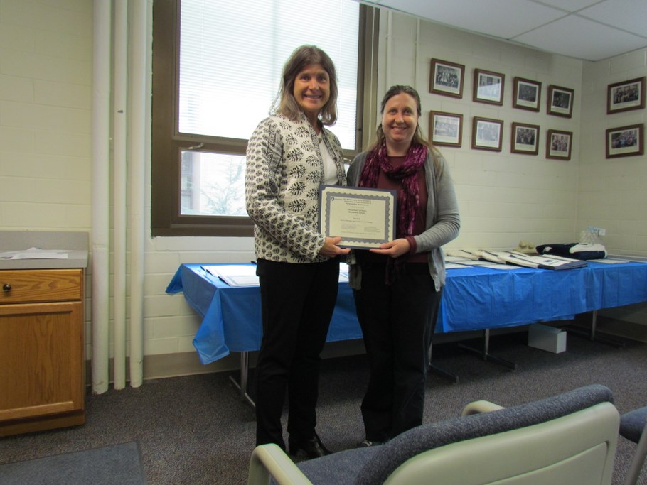 Dr. Carolee Bull (L) presenting Sara May (R) with the Leonard J. Francl Endowment in Support of Graduate Plant Pathology Research certificate.