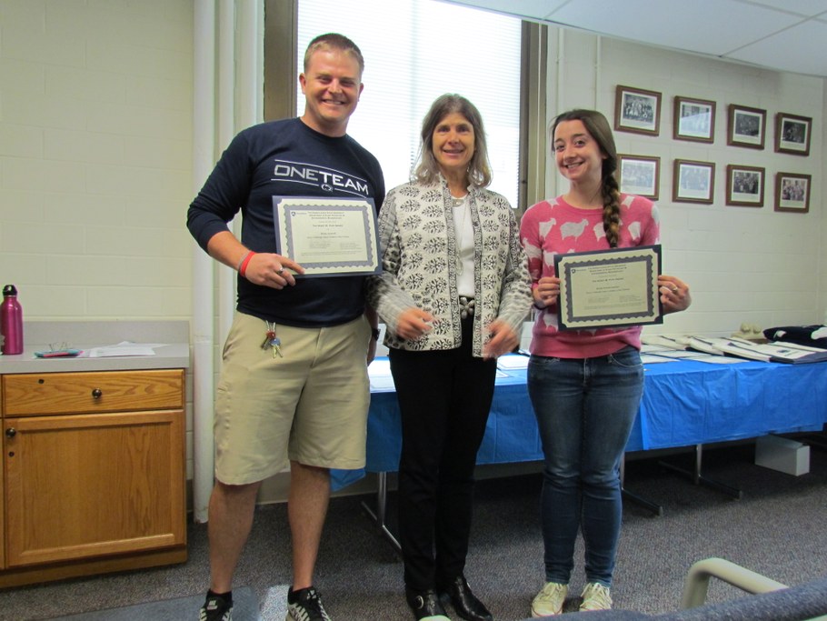 Dr. Carolee Bull (center) presenting Brian Aynardi (L) and Kristi Fenstermacher (R) with the Henry W. Popp Award certificate. Not pictured: Anita Behari, Sara Klee, Freddy Magdama, and Joe Walls.