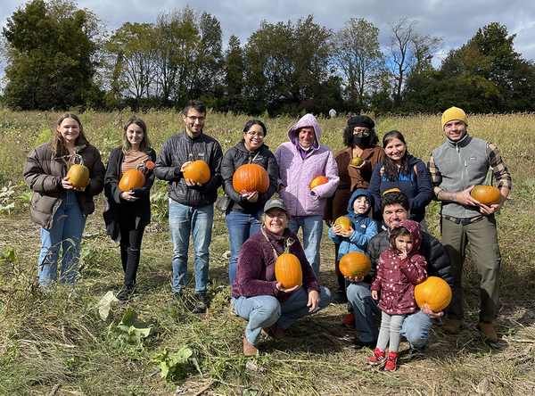 Bull lab members holding pumpkins