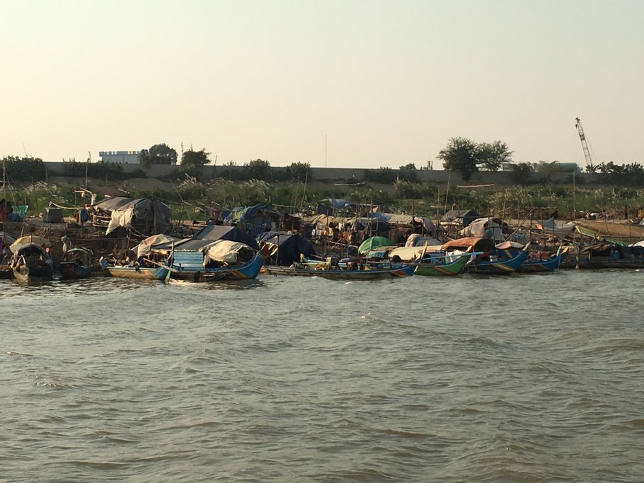 Minority Vietnamese living in traditional wooden boats along Mekong River in Cambodia. Image: Cristina Rosa
